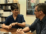 Frameshot of two people talking at a table